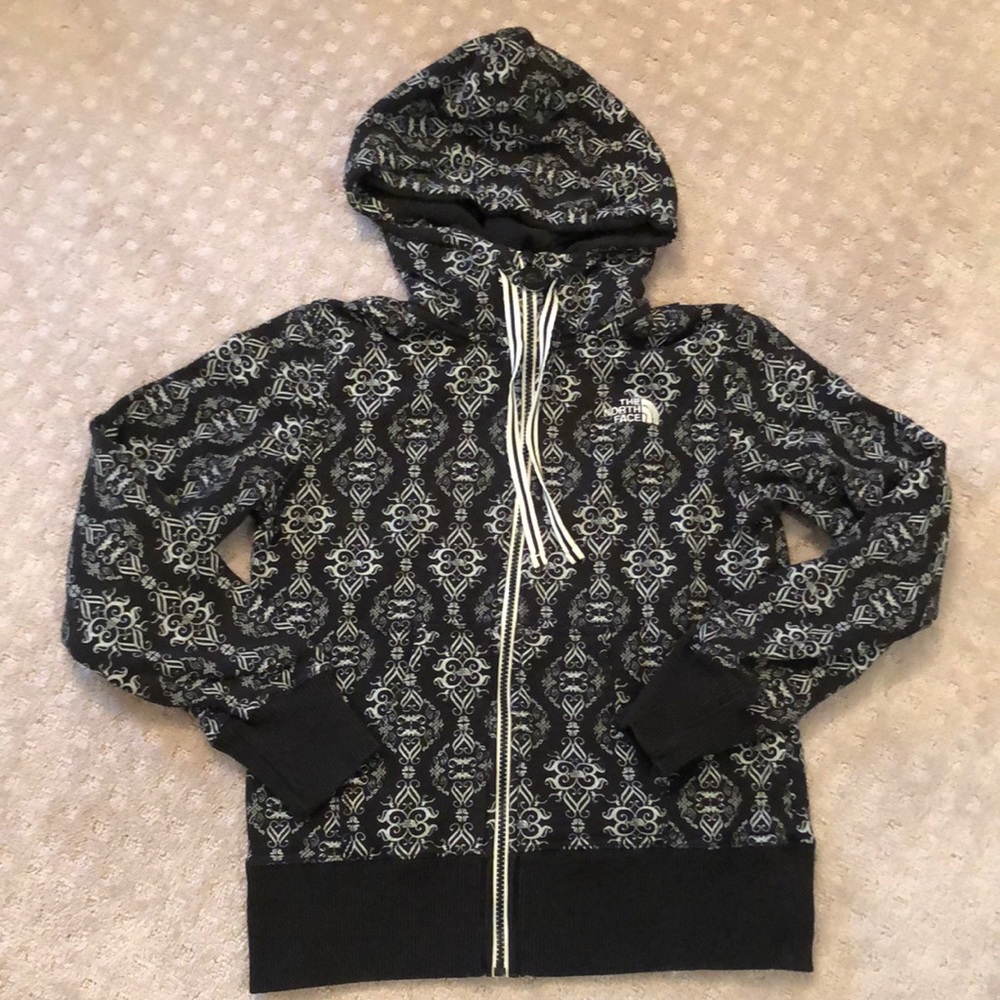 The north face black and white patterned zip up hoodie.  Front pockets.